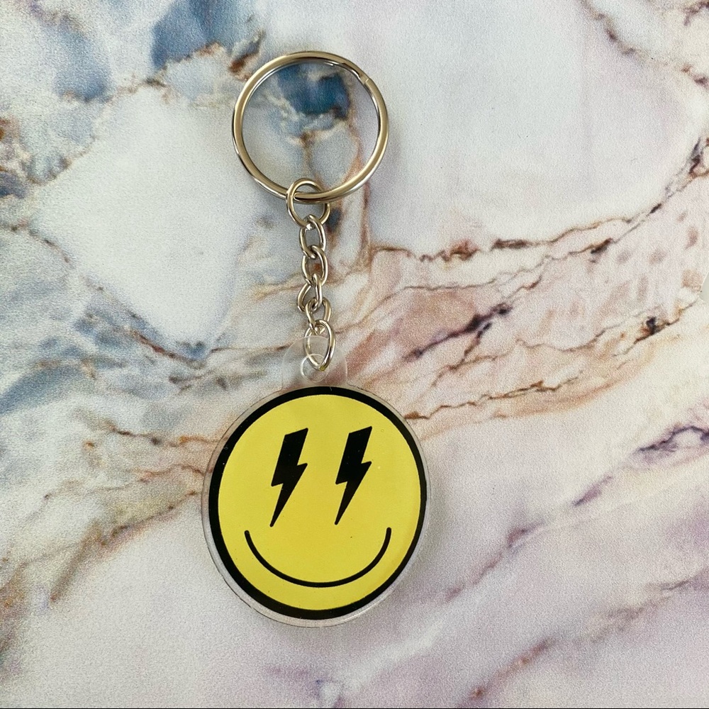 Smiley face lightning bolt eyes keychain